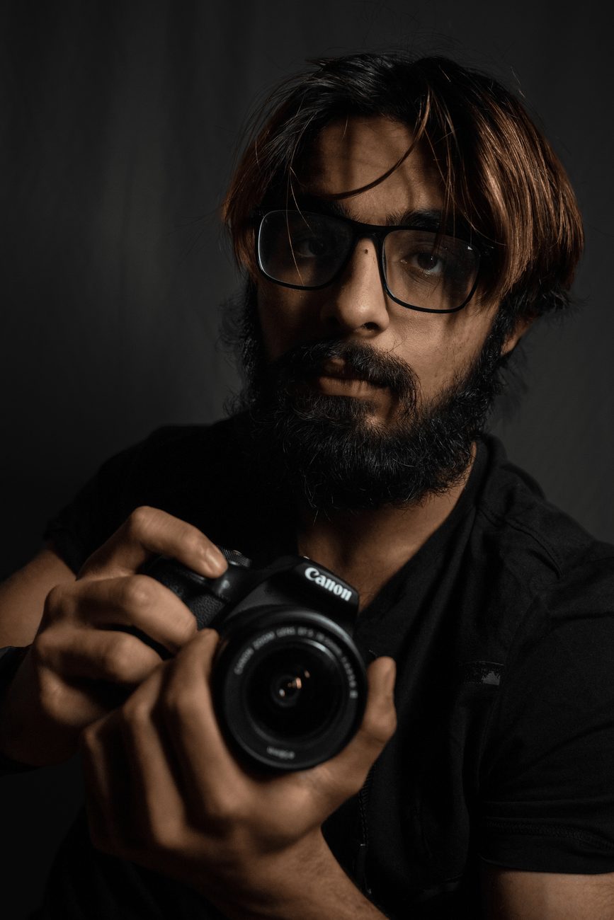 Ishan Kapoor,  photographer, holding a camera